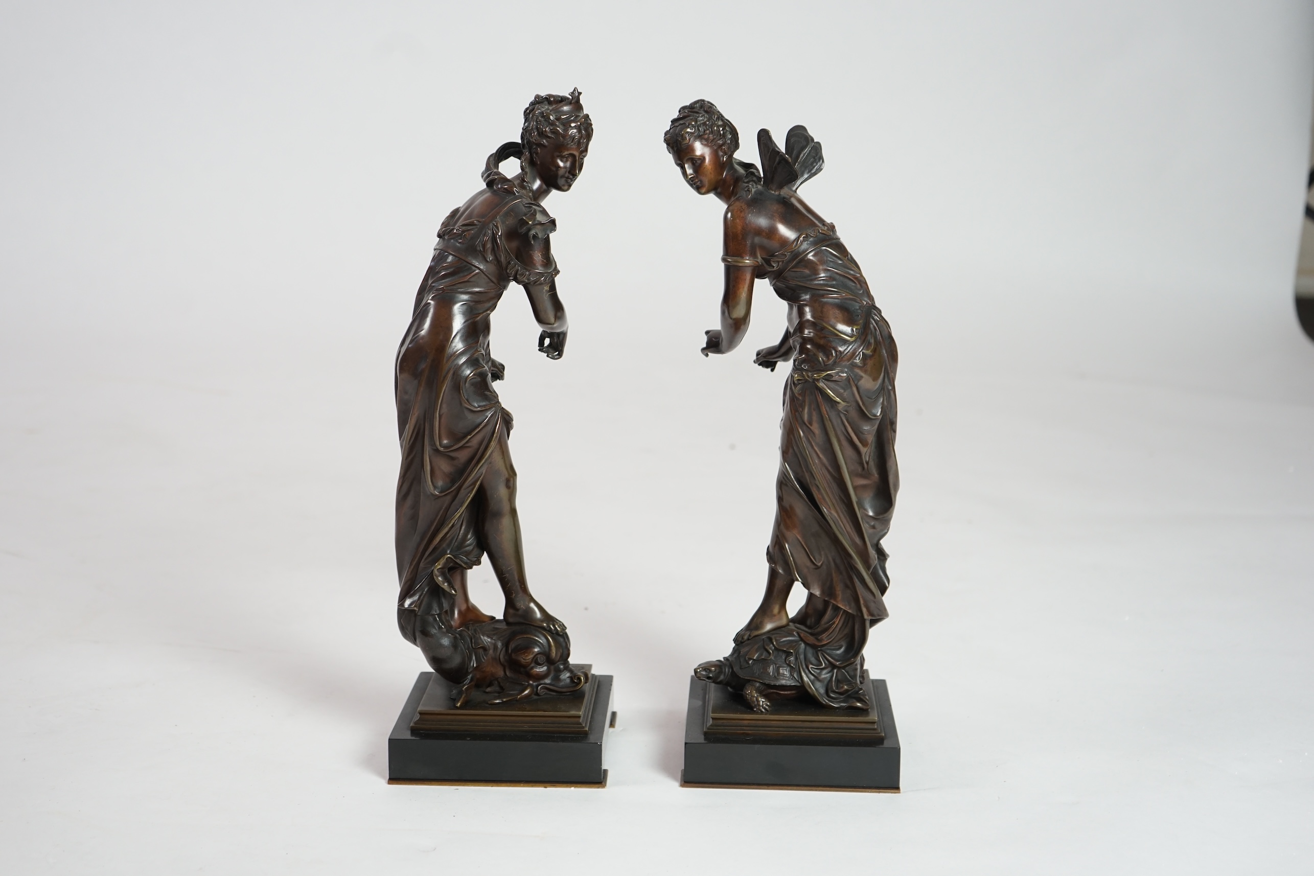 Eutrope Bouret, (French 1833-1906). A pair of late 19th century patinated bronze figures of Venus riding a dolphin and a nymph riding a tortoise